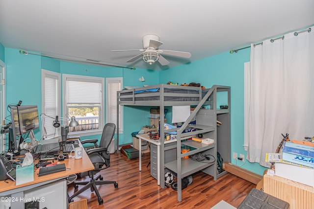 bedroom featuring hardwood / wood-style flooring and ceiling fan