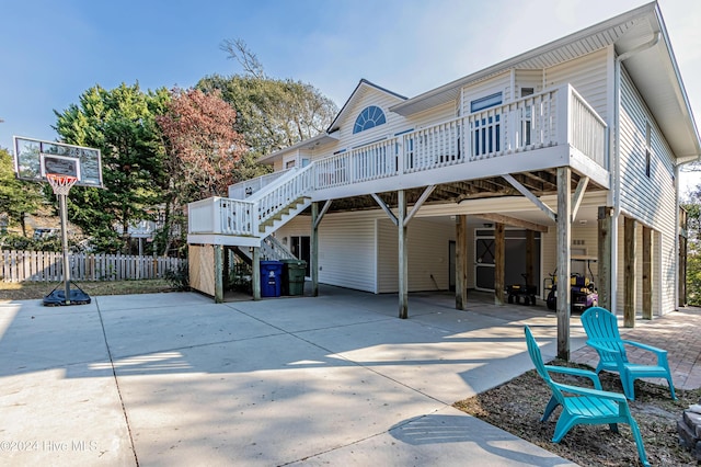 rear view of house with a wooden deck