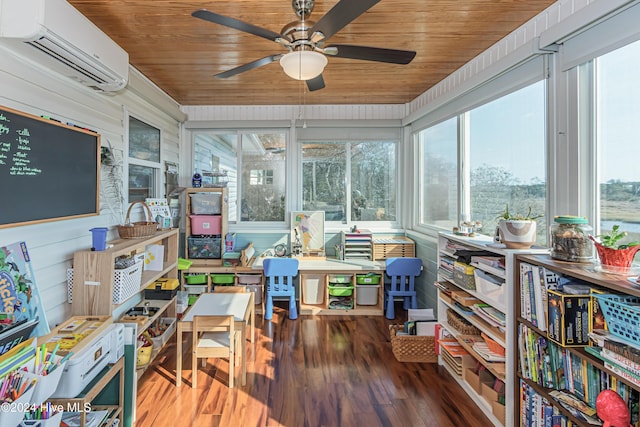 sunroom with ceiling fan, an AC wall unit, and wooden ceiling