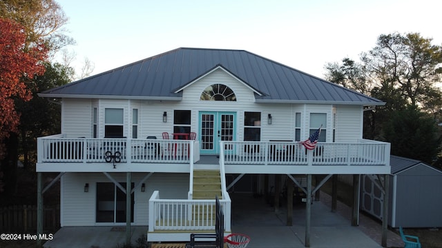 back of house with a carport