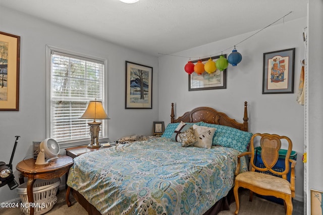 carpeted bedroom featuring multiple windows