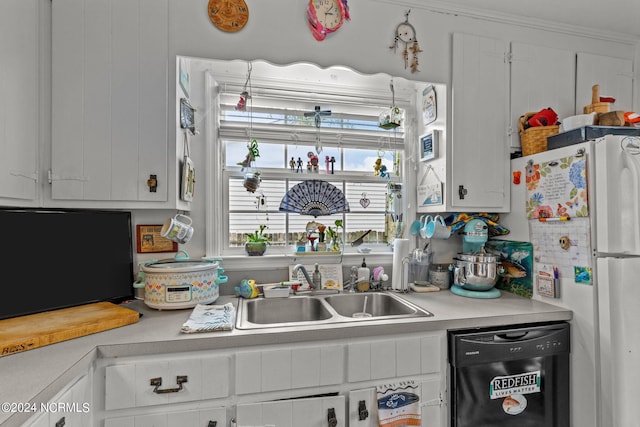 kitchen featuring crown molding, white cabinetry, sink, and black appliances