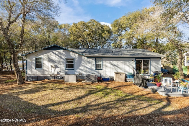 151 Hoop Pole Creek Dr Unit E & W, Atlantic Beach, NC 28512 - rear view of property with a yard and a patio area