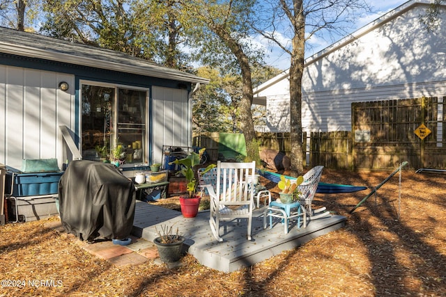 view of patio featuring area for grilling and a deck