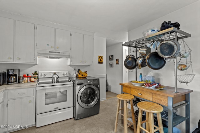 kitchen featuring white cabinets, white range with electric stovetop, and washer / clothes dryer