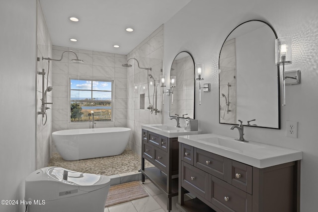 bathroom with vanity, shower with separate bathtub, and tile walls