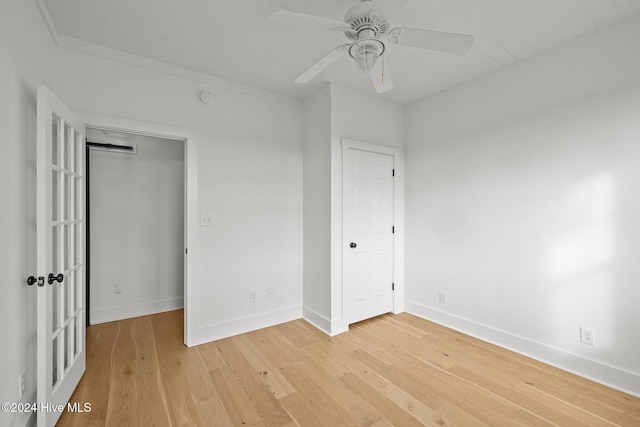 unfurnished bedroom with ceiling fan, light hardwood / wood-style floors, and a closet