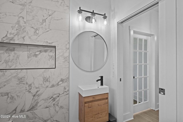 bathroom featuring hardwood / wood-style flooring and vanity