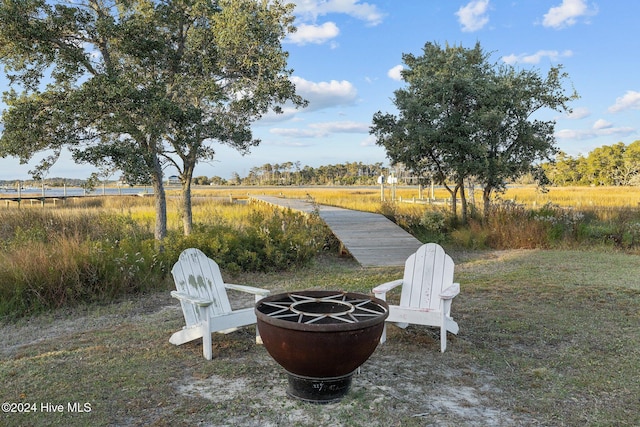 view of yard with an outdoor fire pit