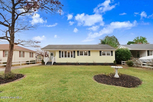 view of front of property with a front lawn