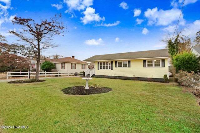 view of front of home with a front lawn