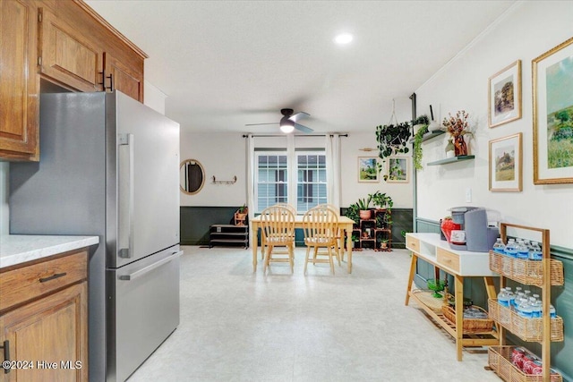 kitchen with stainless steel refrigerator and ceiling fan