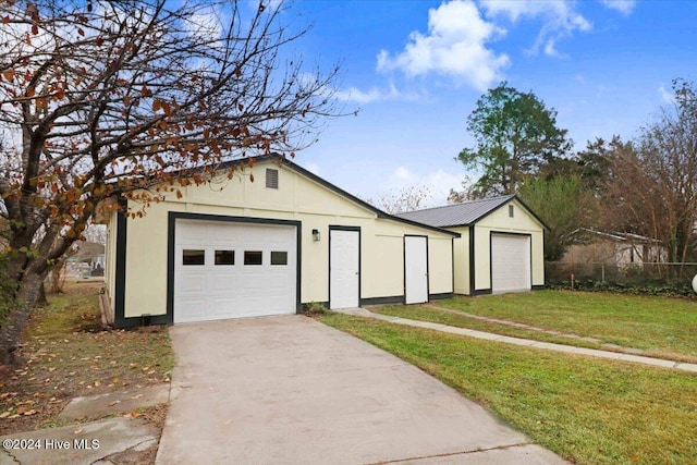 garage with a lawn