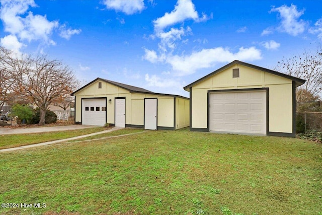 garage featuring a yard