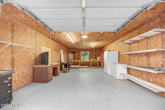 garage featuring white refrigerator