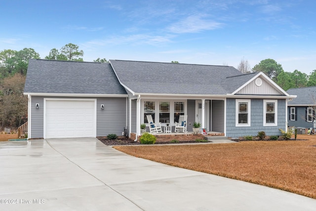 ranch-style house with covered porch and a garage