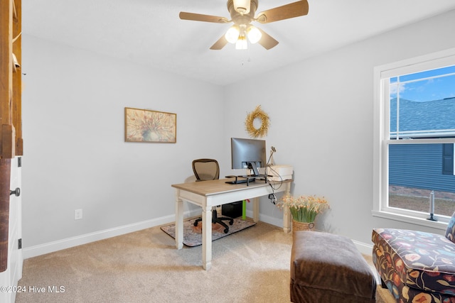 carpeted office with ceiling fan