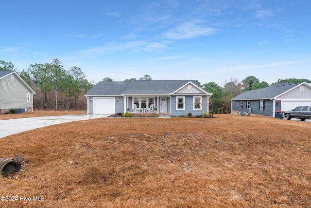 ranch-style house with a garage and covered porch