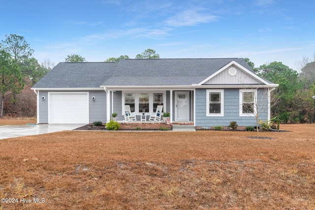 ranch-style home featuring a porch and a garage