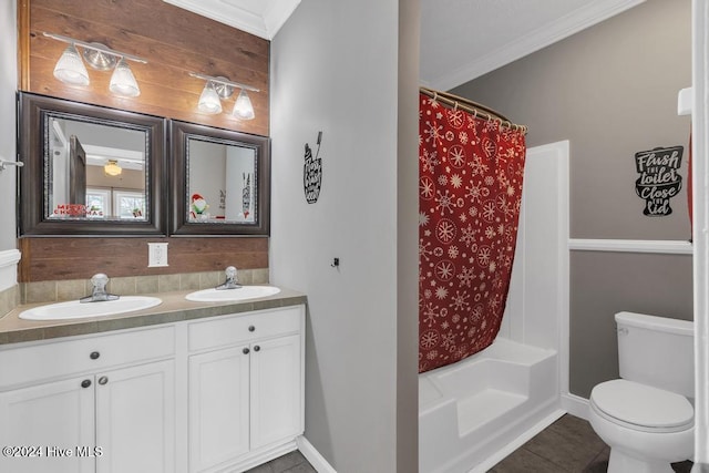 full bathroom featuring shower / bathtub combination with curtain, tile patterned floors, crown molding, toilet, and vanity