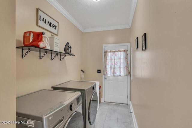 washroom with separate washer and dryer, crown molding, and a textured ceiling