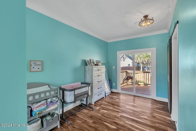 home office with hardwood / wood-style floors and crown molding