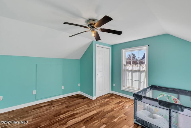 bonus room with wood-type flooring, ceiling fan, and lofted ceiling