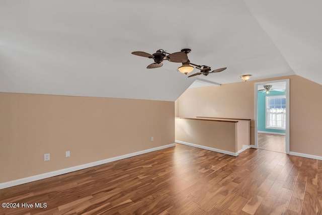 bonus room with hardwood / wood-style floors, ceiling fan, and lofted ceiling