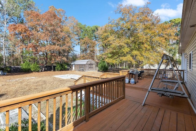 wooden deck with an outbuilding