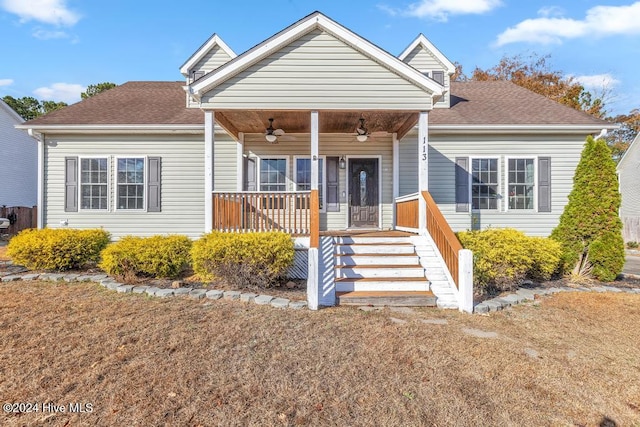 view of front of property featuring ceiling fan and a porch