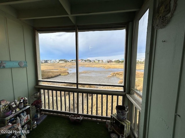 sunroom / solarium featuring a healthy amount of sunlight