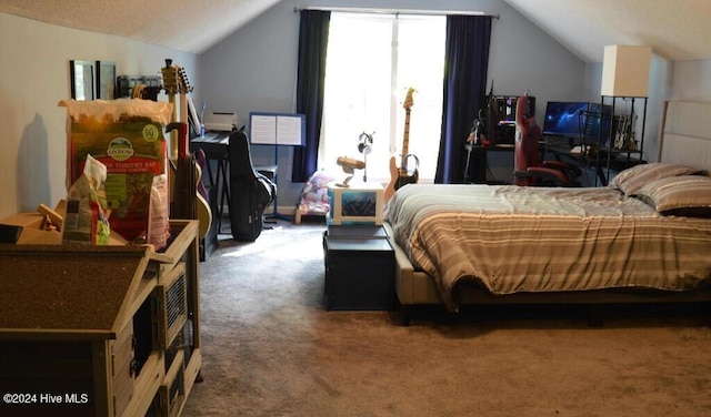 carpeted bedroom with lofted ceiling