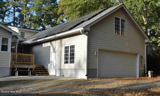 view of property exterior featuring a garage