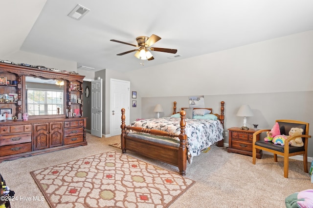 carpeted bedroom featuring ceiling fan and vaulted ceiling