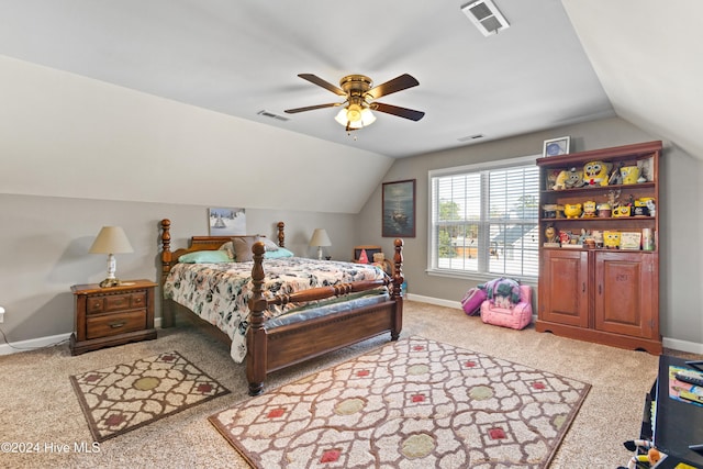 bedroom with ceiling fan, light colored carpet, and lofted ceiling