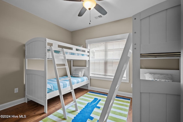 bedroom with ceiling fan and hardwood / wood-style floors