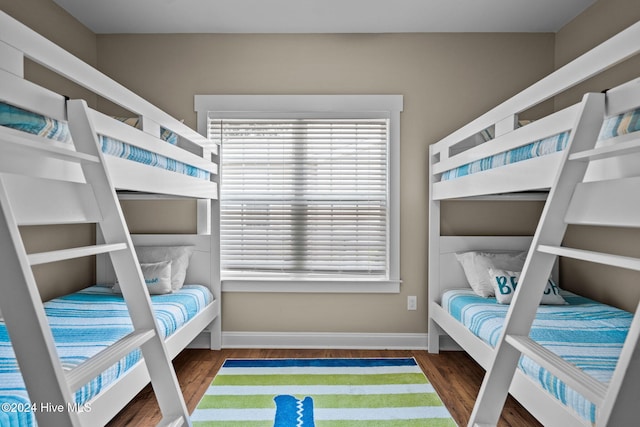 bedroom featuring dark wood-type flooring