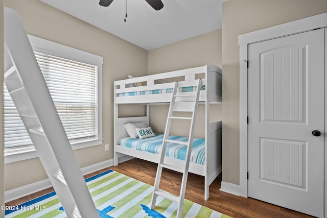 bedroom with ceiling fan and dark wood-type flooring