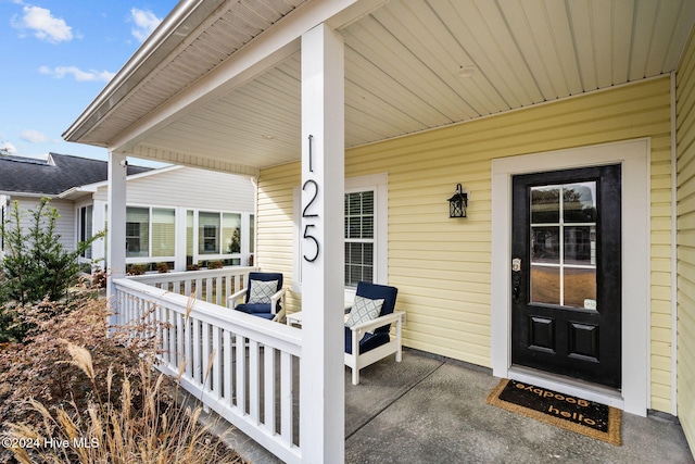 doorway to property with a porch