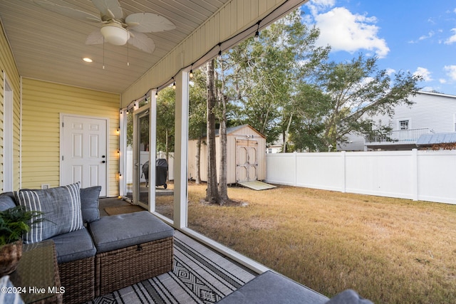 exterior space with ceiling fan and a shed