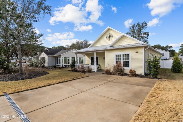 view of front facade with covered porch and a front yard