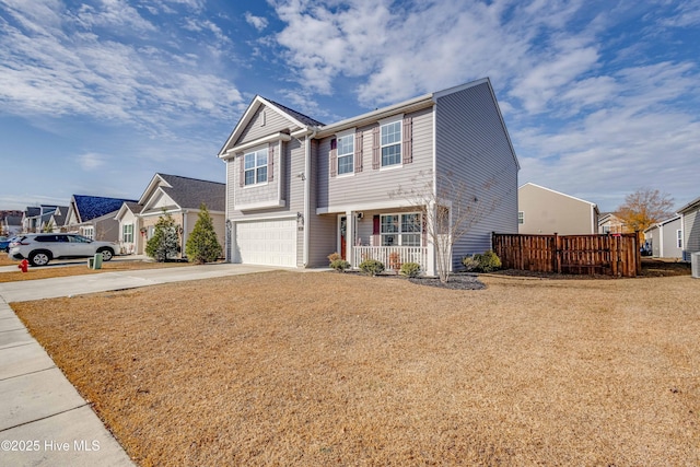 view of front of property with a porch and a garage