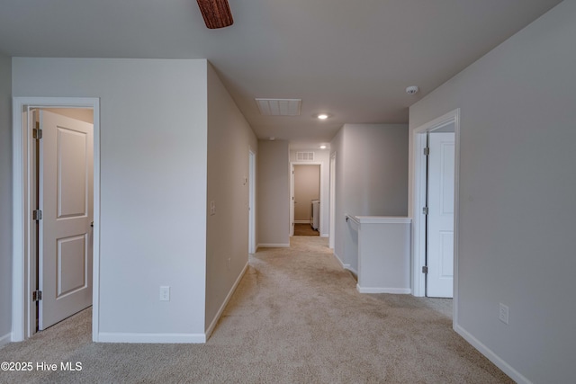 hallway with carpet floors, baseboards, and recessed lighting