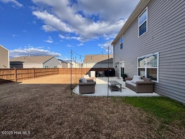 view of yard featuring an outdoor living space and a patio area