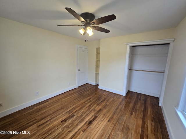 unfurnished bedroom featuring ceiling fan, dark hardwood / wood-style flooring, and a closet