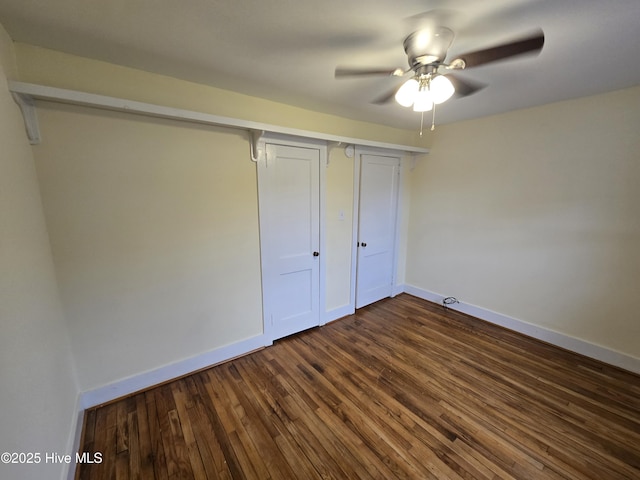 unfurnished bedroom featuring dark wood-type flooring, a closet, and ceiling fan