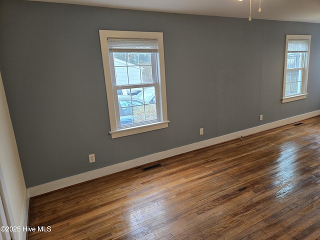 empty room with wood-type flooring