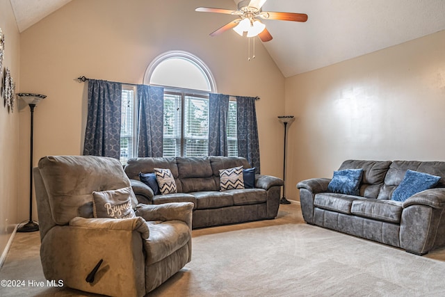 living room with light carpet, high vaulted ceiling, and ceiling fan