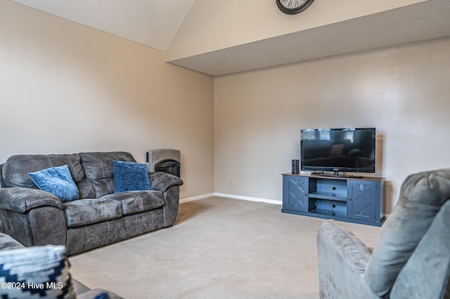 carpeted living room with vaulted ceiling