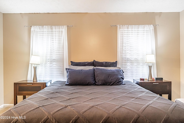 bedroom with multiple windows